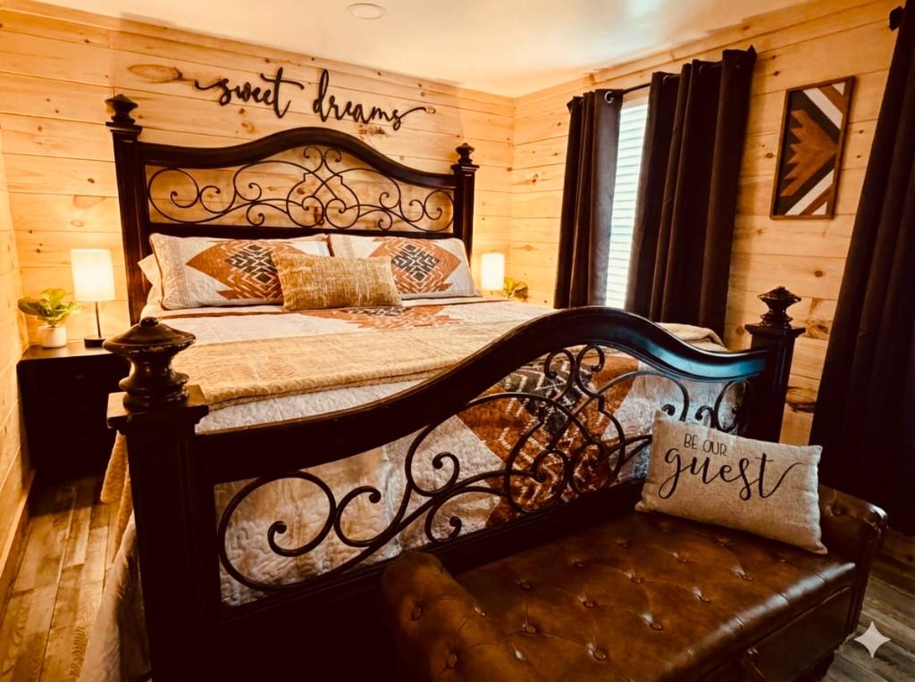 Blue Ridge Haven bedroom with king bed and wood-paneled walls