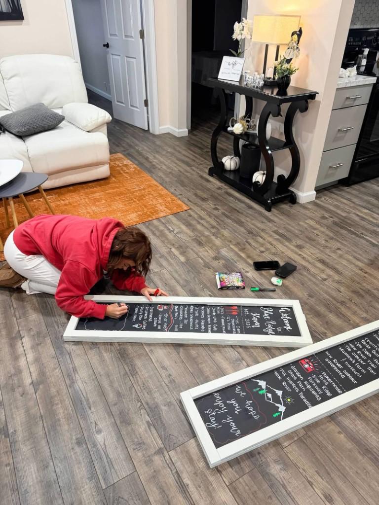 Blue Ridge Haven — Host finishing hand-lettered welcome boards with local eats and adventures