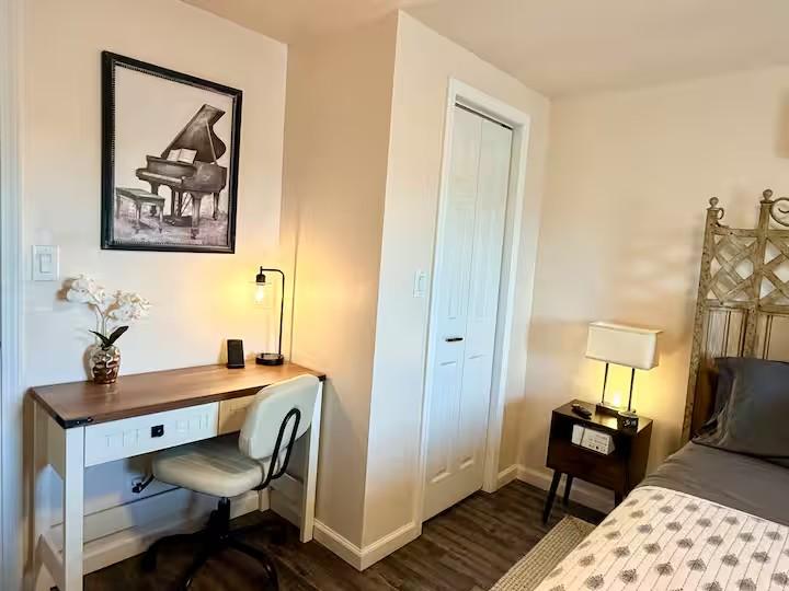 Fiddlers Roost full bathroom with vanity, shower, and towel storage