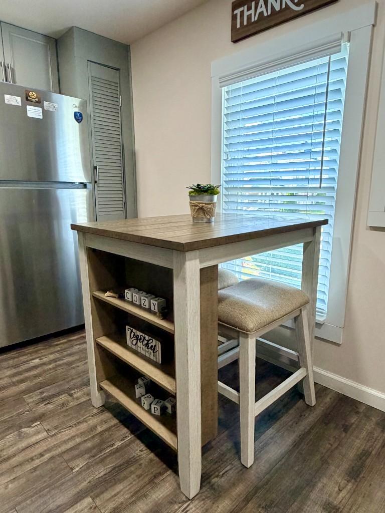 Fiddlers Roost — Kitchen dining table with stool seating near the window