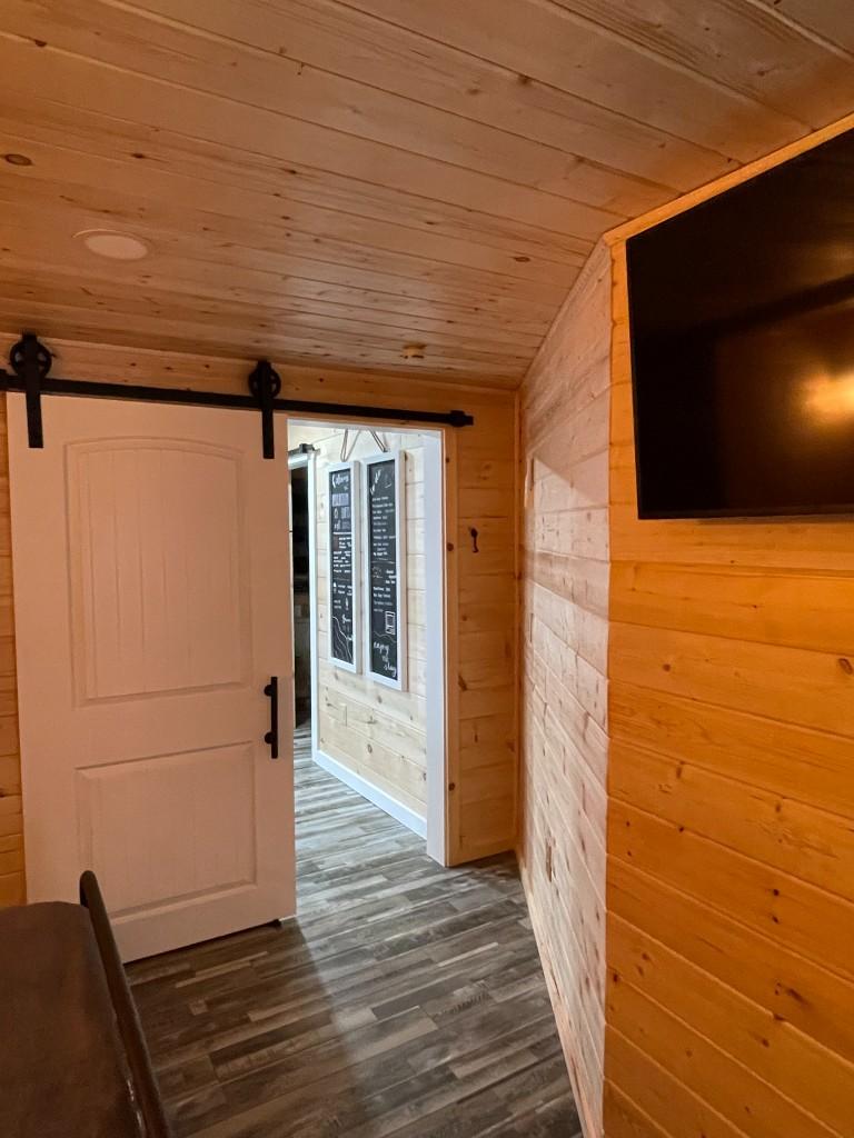 New River Hideaway sliding barn door and wall-mounted TV